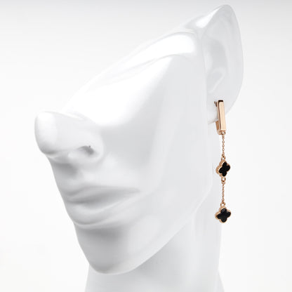 Enamel double-clover earrings on clear display — Kabluchka