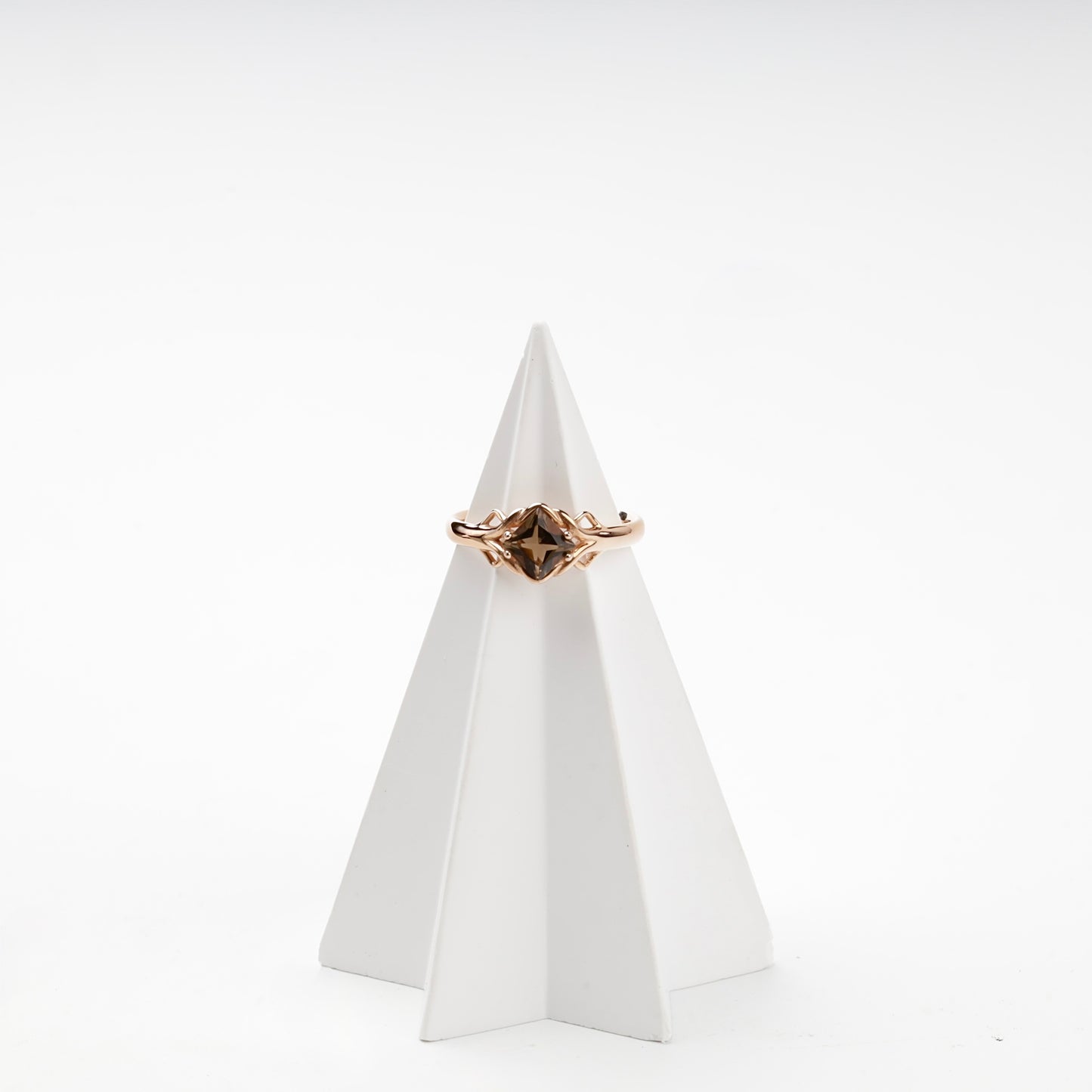 Faceted smoky quartz diagonal-set ring on display — Kabluchka