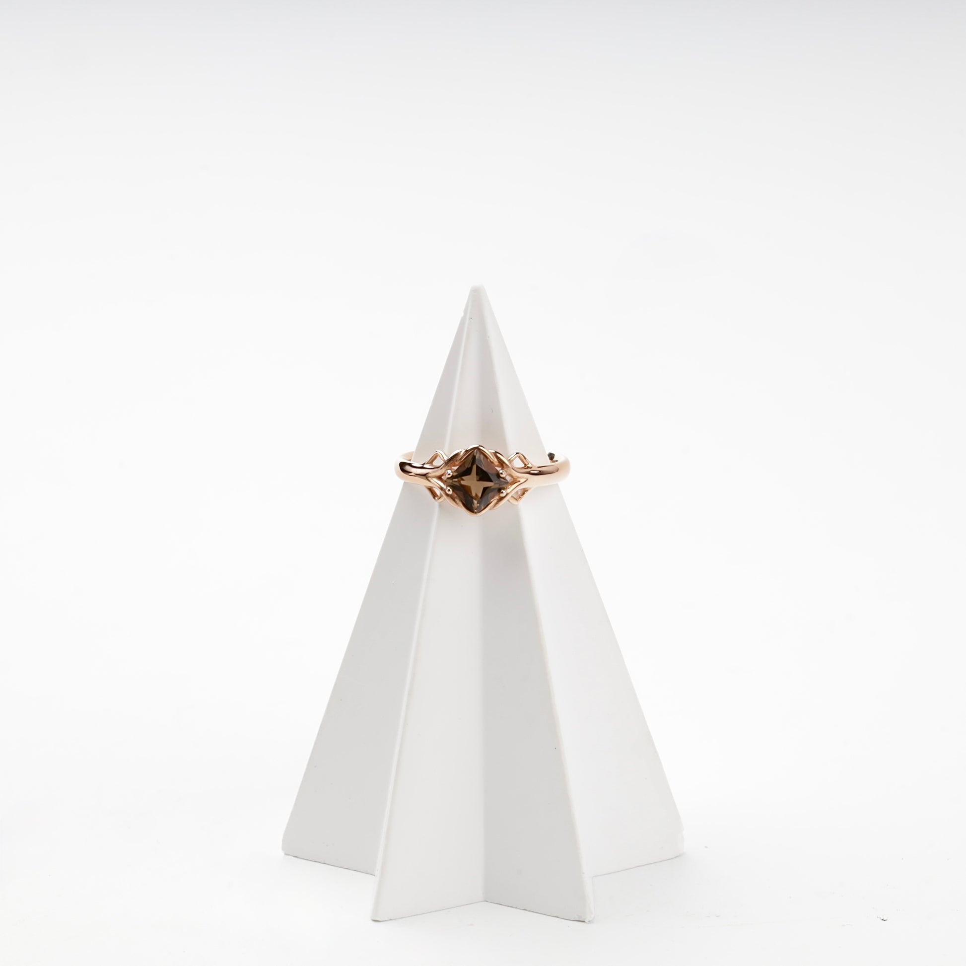 Faceted smoky quartz diagonal-set ring on display — Kabluchka