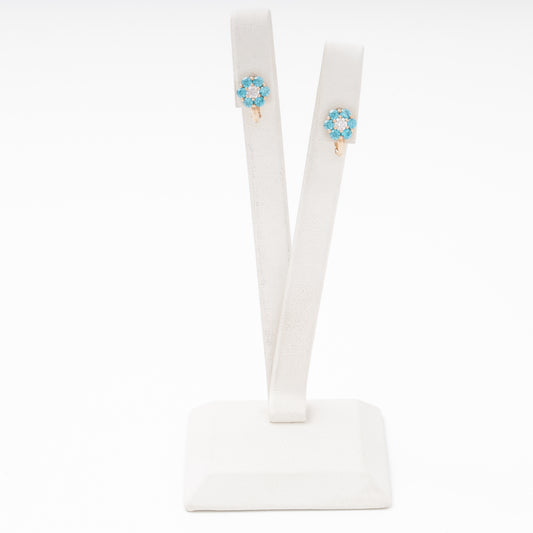 Rose gold flower earrings 14K with blue and white cubic zirconia on stand — Kabluchka