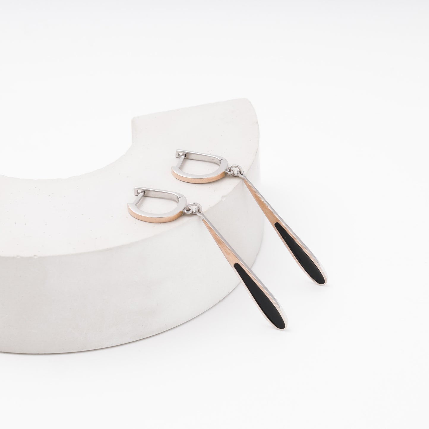 Black enamel teardrop earrings on model — silver and rose gold — Kabluchka