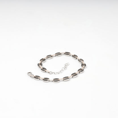 Black cubic zirconia link bracelet laid flat — Kabluchka