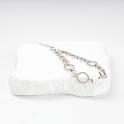 Round zirconia and oval gold link bracelet detail — Kabluchka