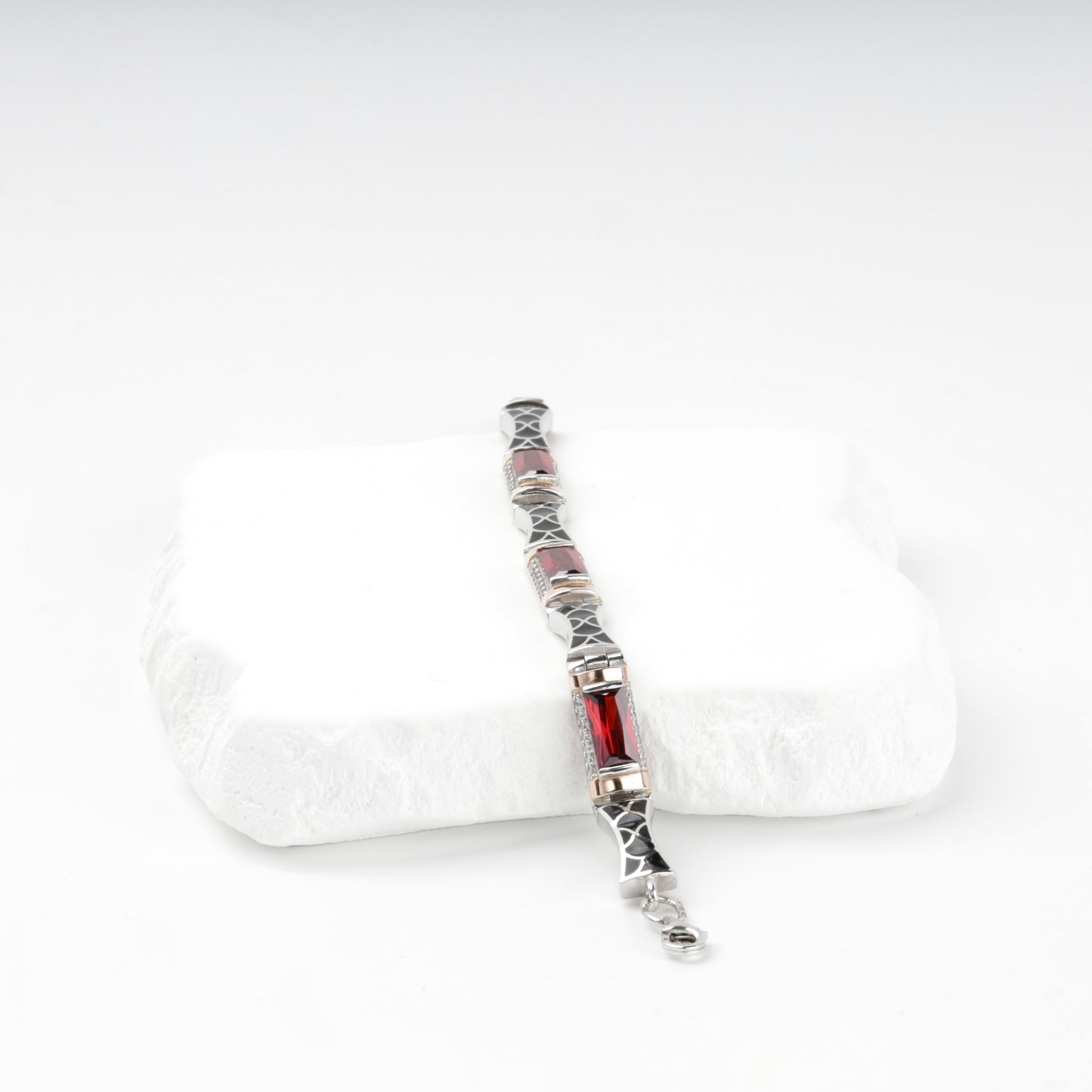 Red cubic zirconia and black enamel bracelet links — detail view — Kabluchka