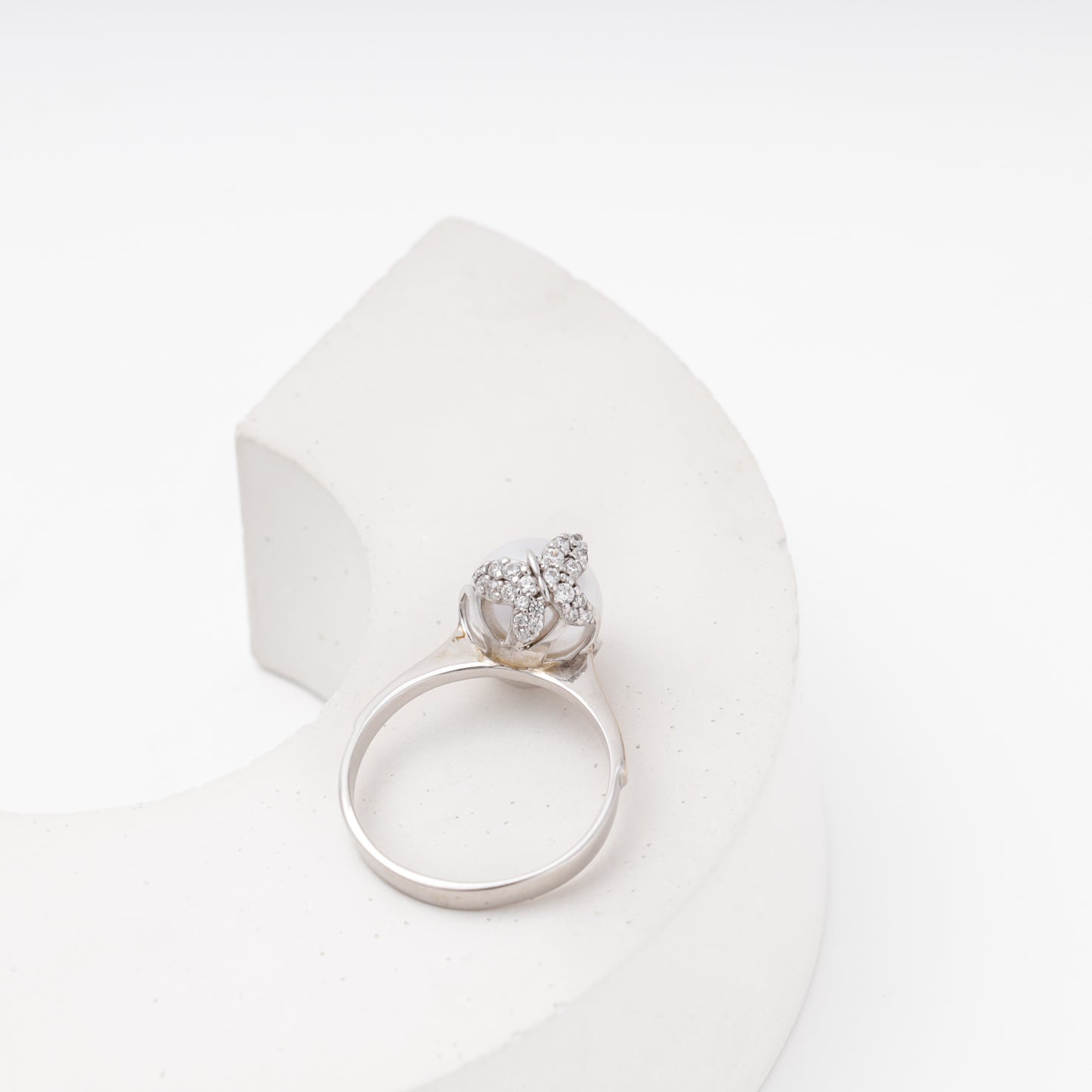 Top view — CZ pave crown with imitation pearl center — Kabluchka ring