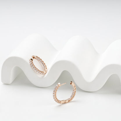 Clear-stone rose gold hoop earrings with hinged posts