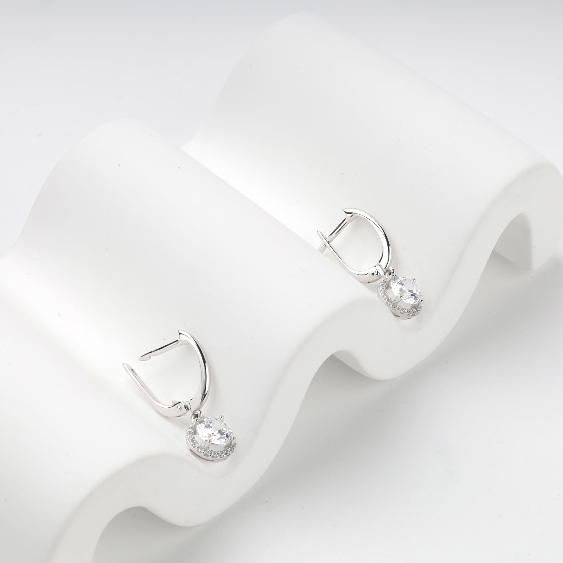 Cubic zirconia drop earrings, angled closure detail