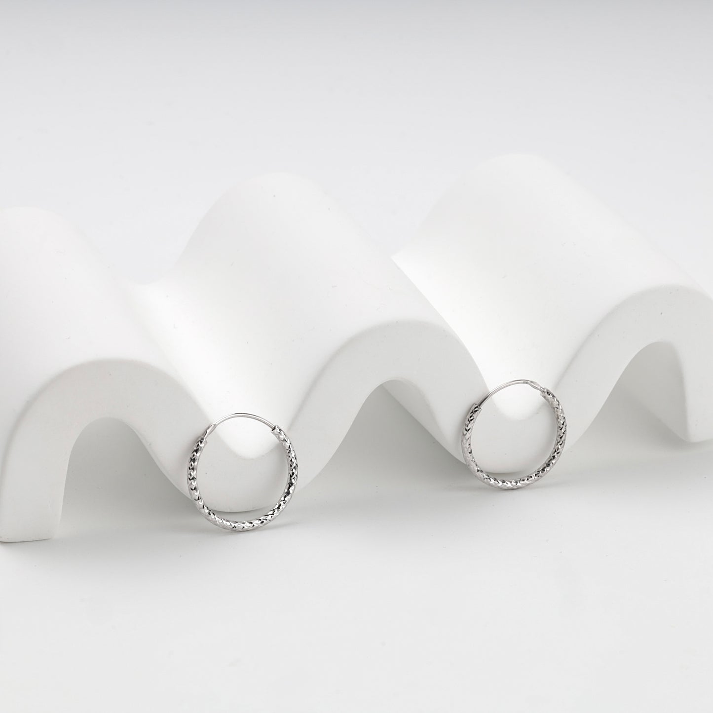 Diamond-cut texture on slim Silver 925 hoops