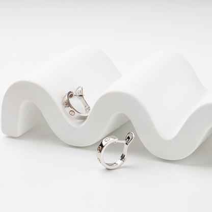 Gold 585 hoop earrings showing polished two-tone profile