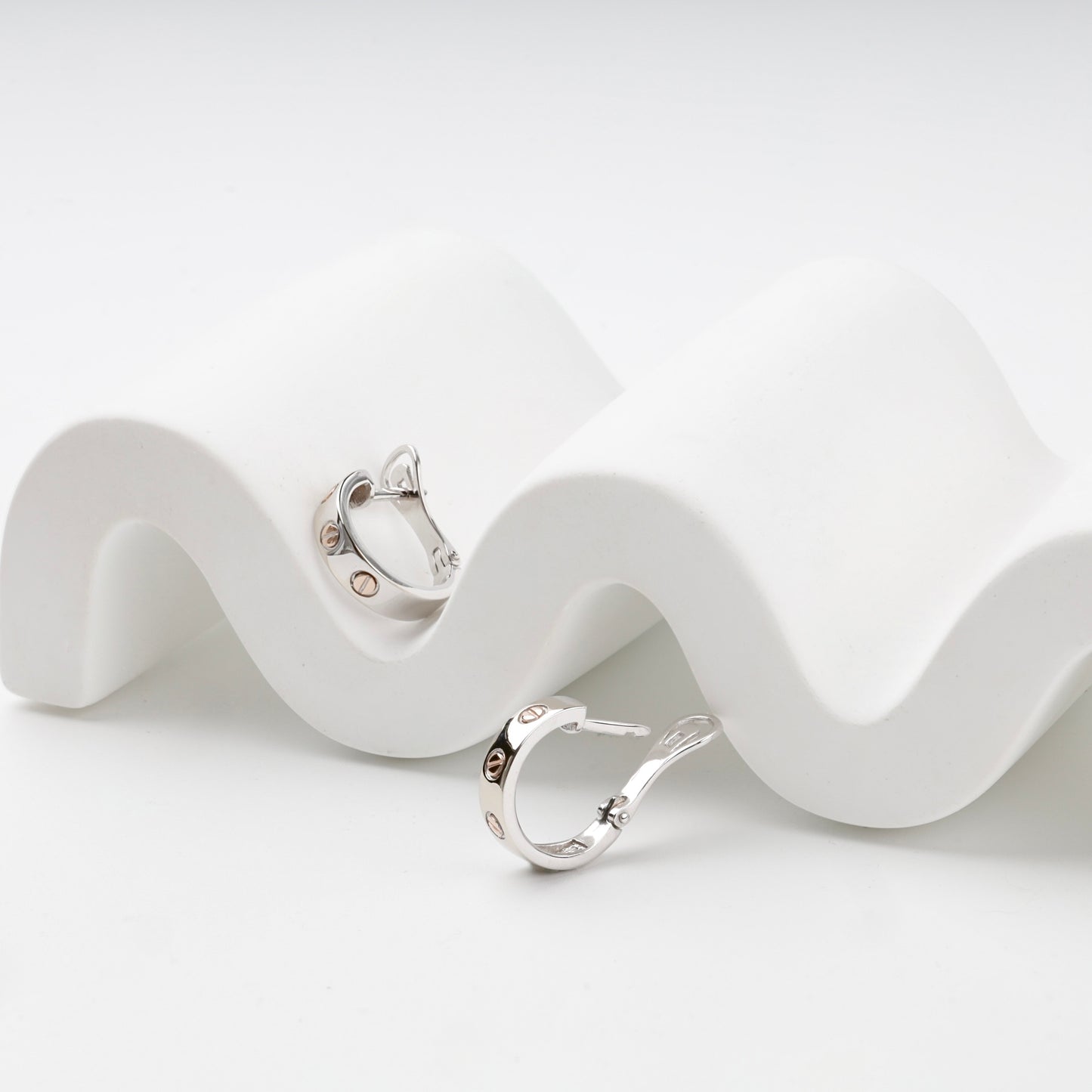Two-tone gold hoop earrings with English leverback closures