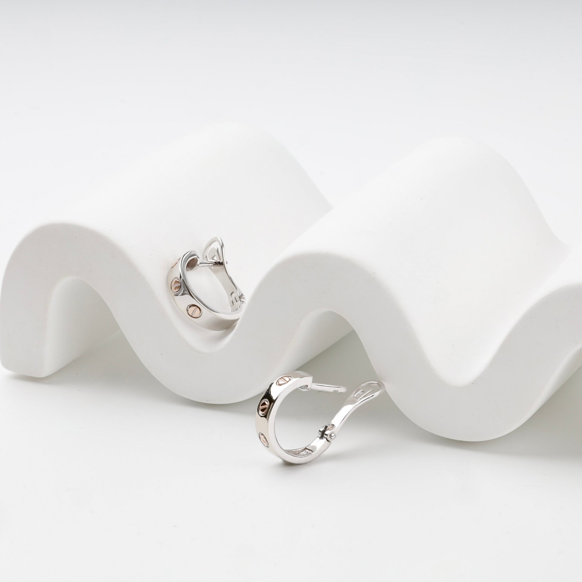 Two-tone gold hoop earrings with English leverback closures