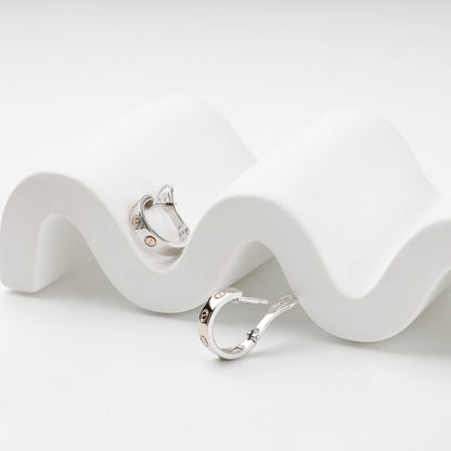 Two-tone gold hoop earrings with English leverback closures