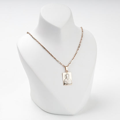 Saint Nicholas gold icon pendant shown with a styling chain