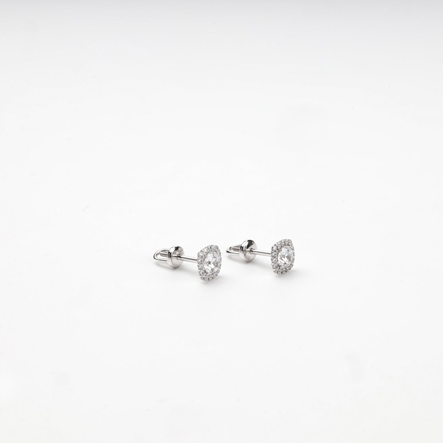 Cushion-shaped cubic zirconia halo studs, angled view