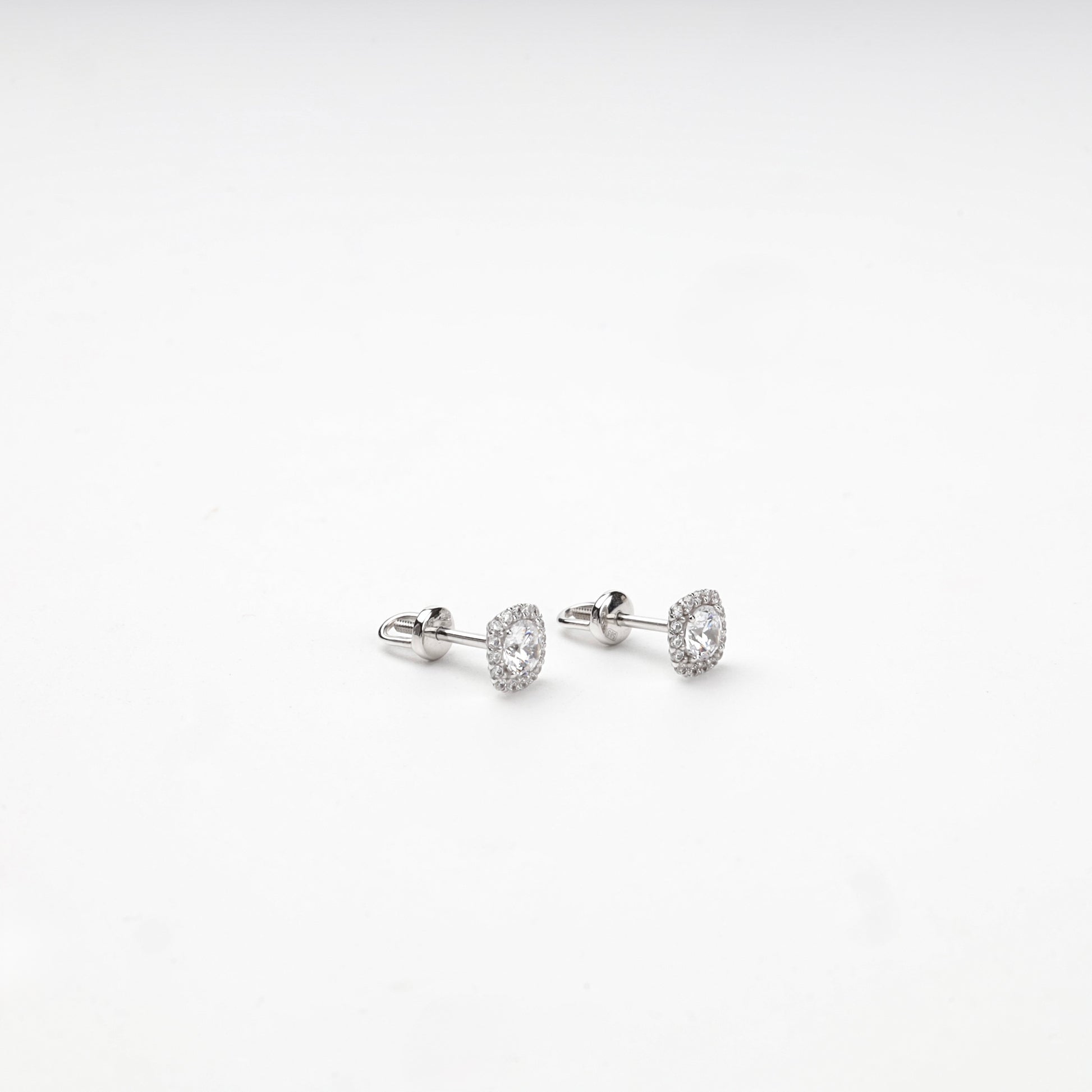 Cushion-shaped cubic zirconia halo studs, angled view