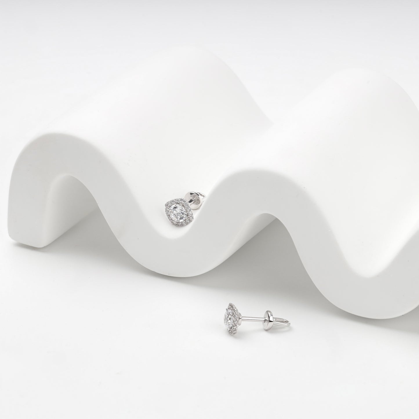 White Gold 585 halo stud earrings, styled detail