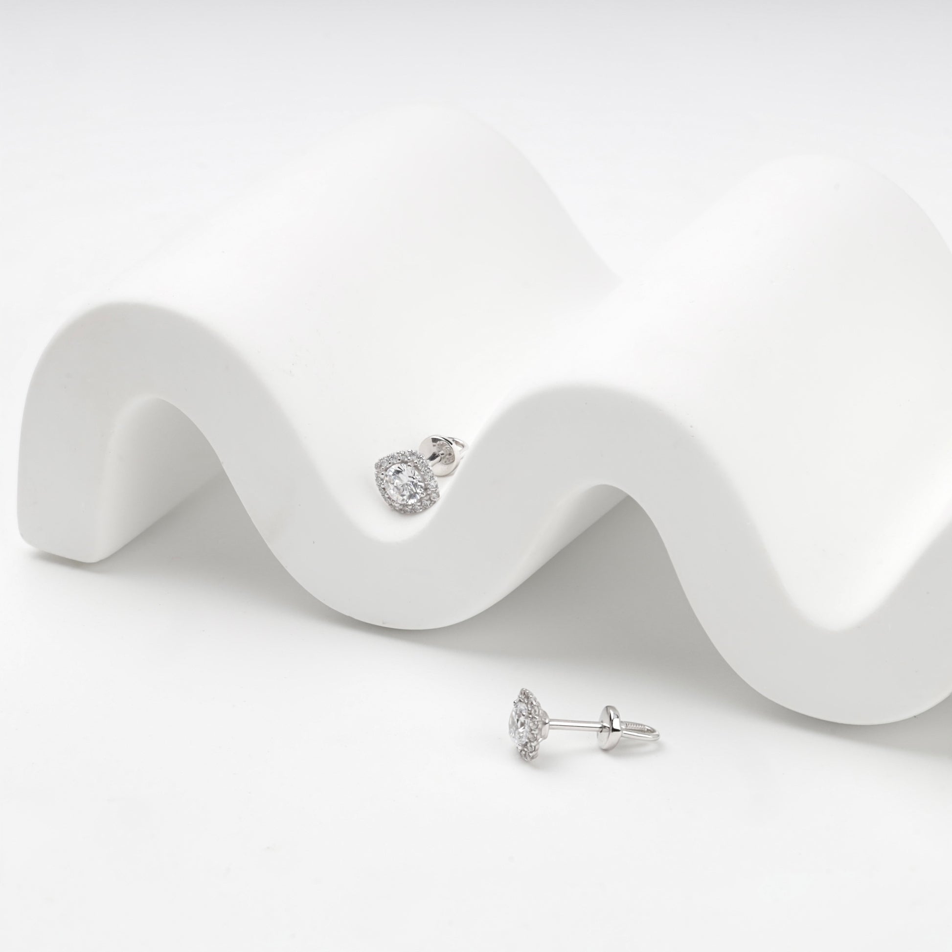 White Gold 585 halo stud earrings, styled detail