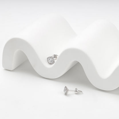 White Gold 585 halo stud earrings, styled detail
