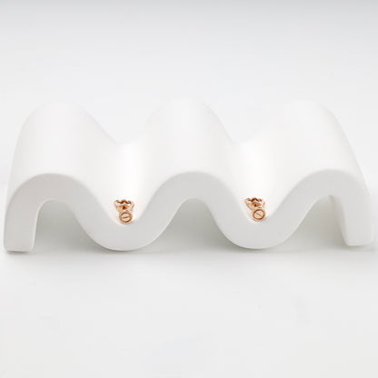 Minimalist round screw motif stud earrings on display — Kabluchka