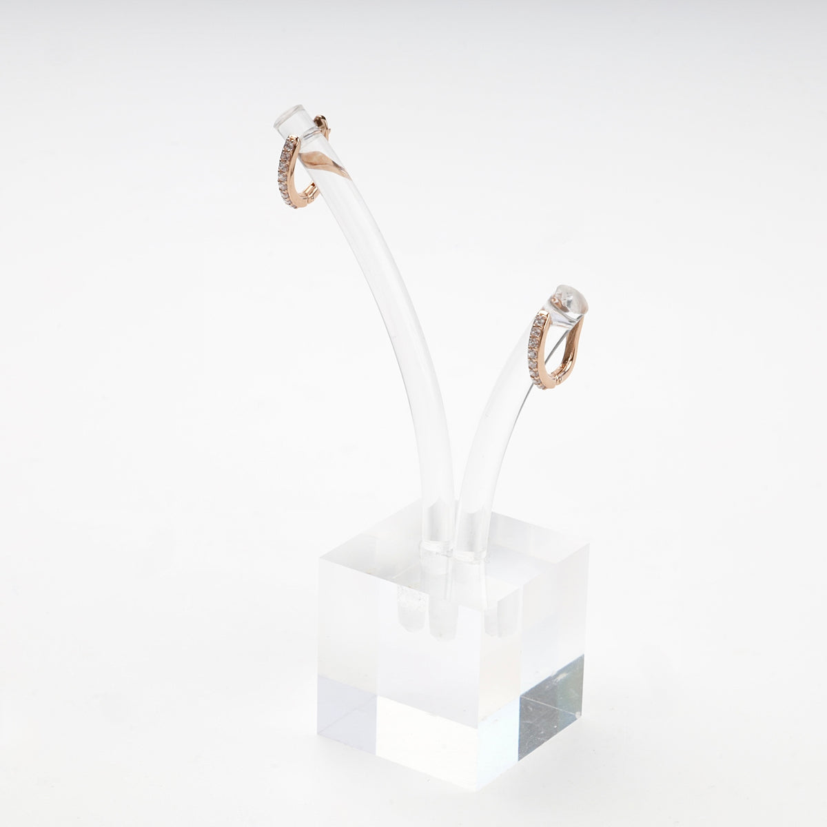 Elongated huggie hoop earrings with cubic zirconia — angled view — Kabluchka