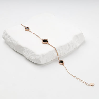 Black onyx clover bracelet on display — Kabluchka
