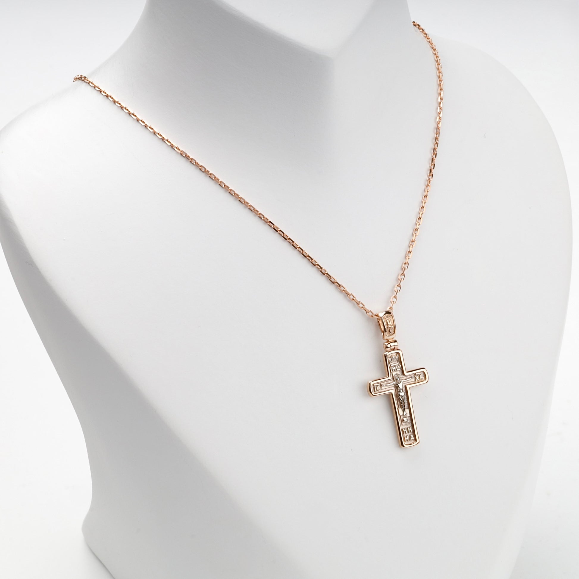 Orthodox crucifix pendant shown with a styling chain