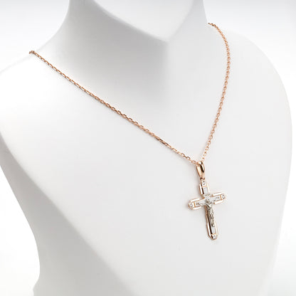 Two-tone religious cross pendant, angled view — Kabluchka