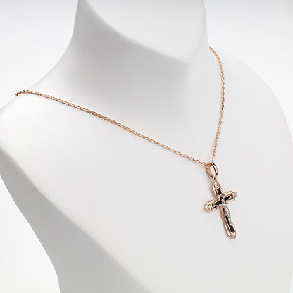 Two-tone religious cross pendant, angled view — Kabluchka