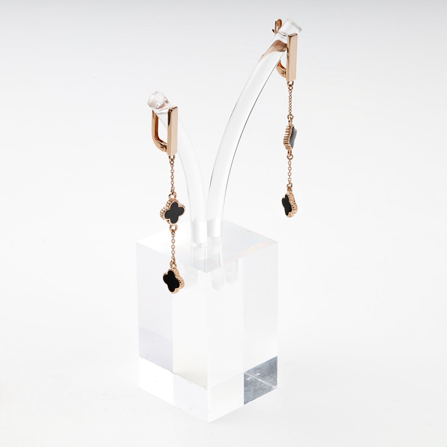 Rose gold clover chain drop earrings on ear — Kabluchka