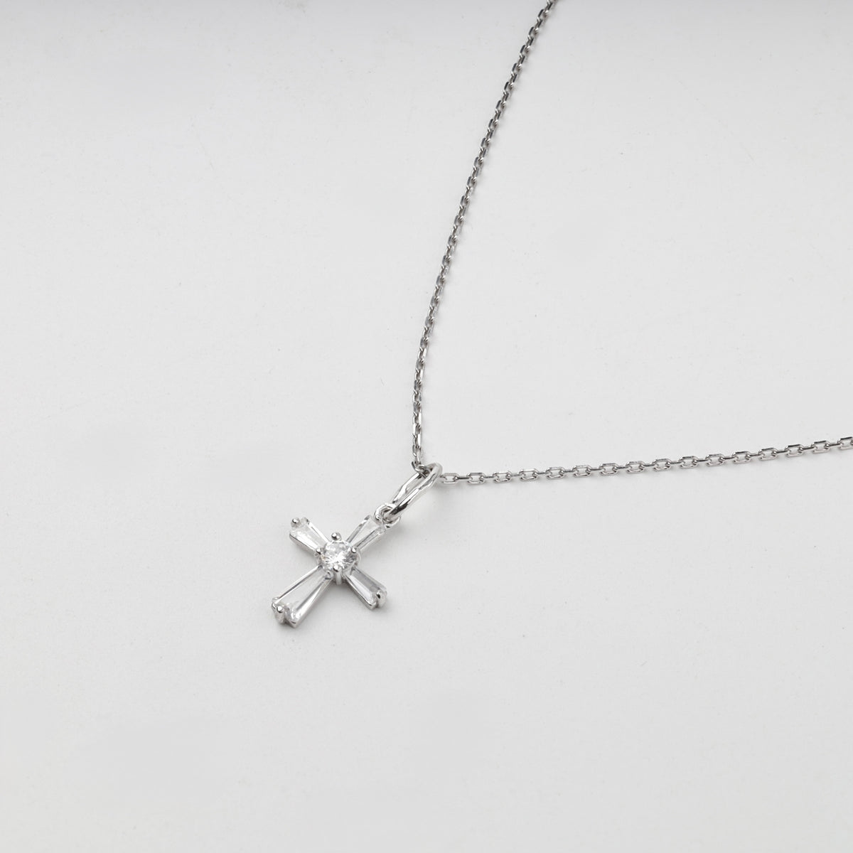 Silver 925 cubic zirconia cross pendant on chain — styled view — Kabluchka