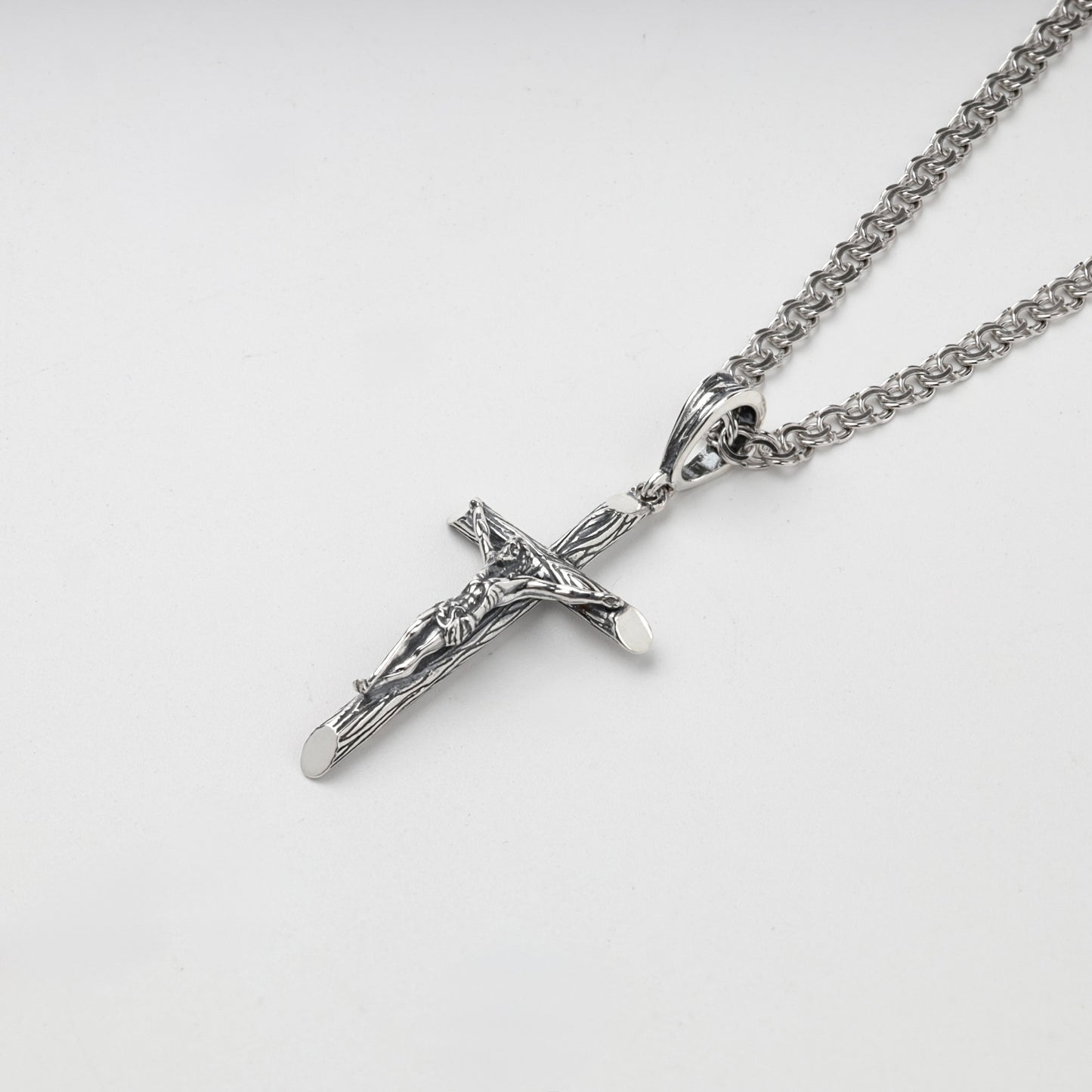Silver 925 crucifix pendant showing darkened recessed details