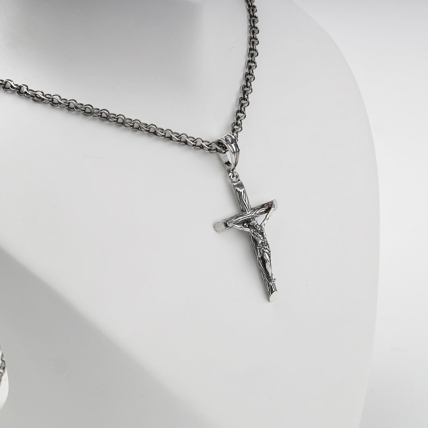 Textured Silver 925 cross pendant, angled view