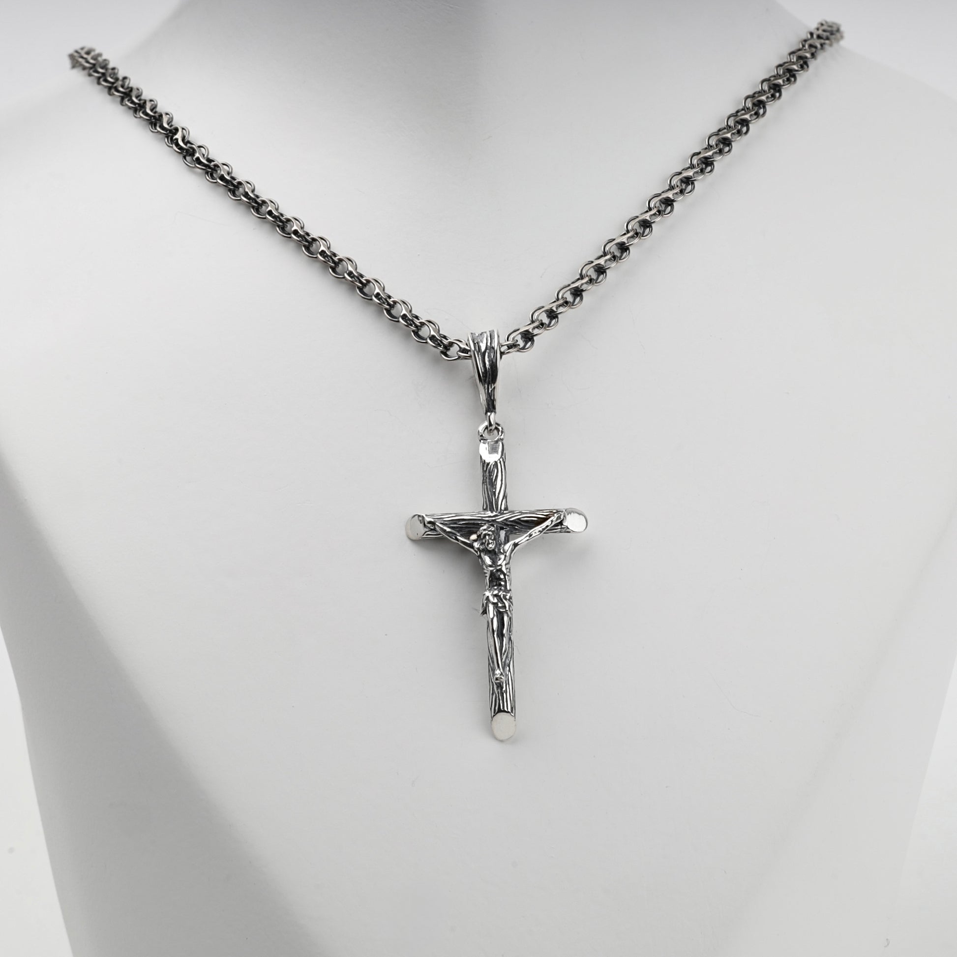 Textured silver crucifix pendant with sculpted Jesus figure