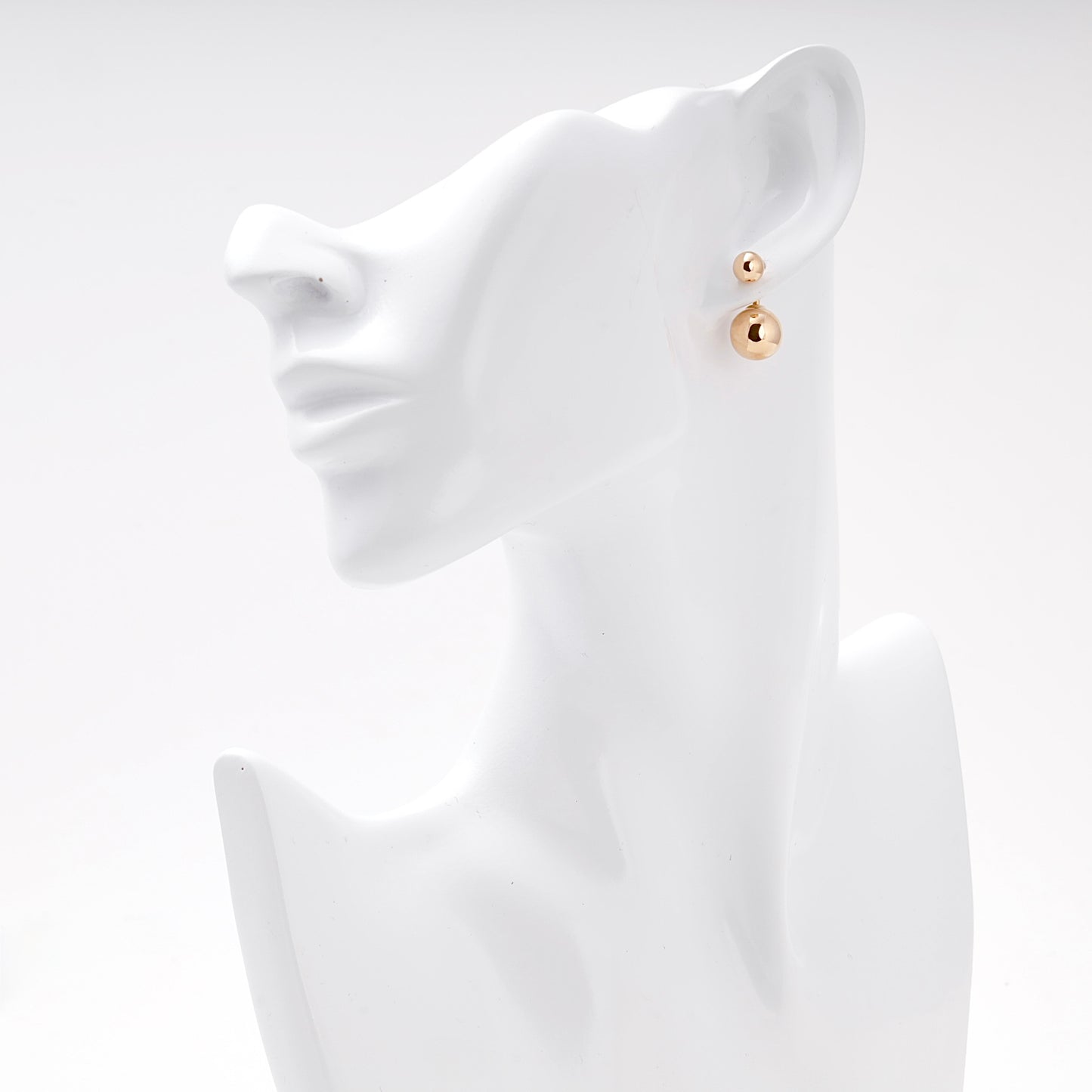 Rose Gold 585 Double Ball Drop Earrings on model ear — Kabluchka
