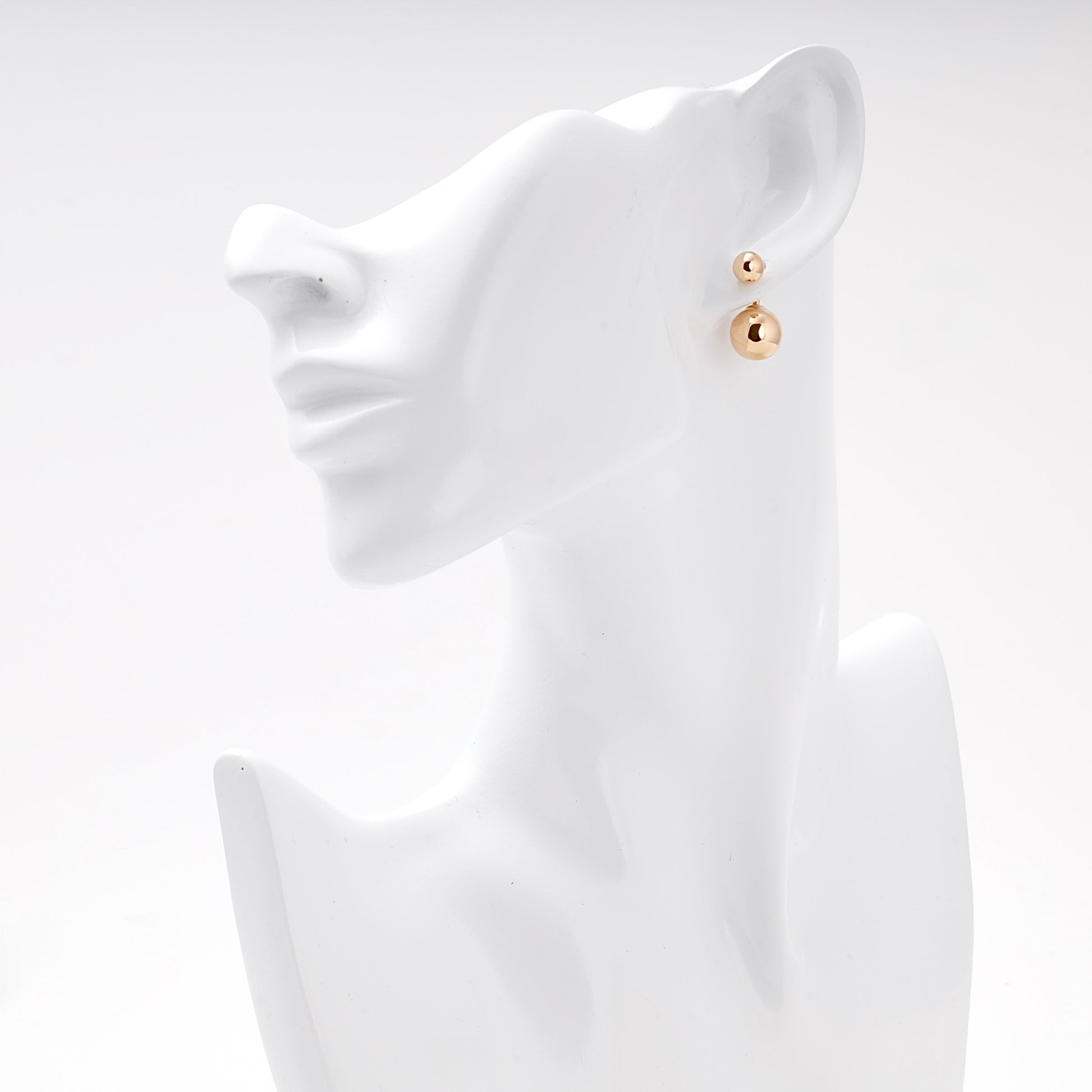 Rose Gold 585 Double Ball Drop Earrings on model ear — Kabluchka