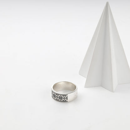 Polished and darkened details on a Ukrainian embroidery ring