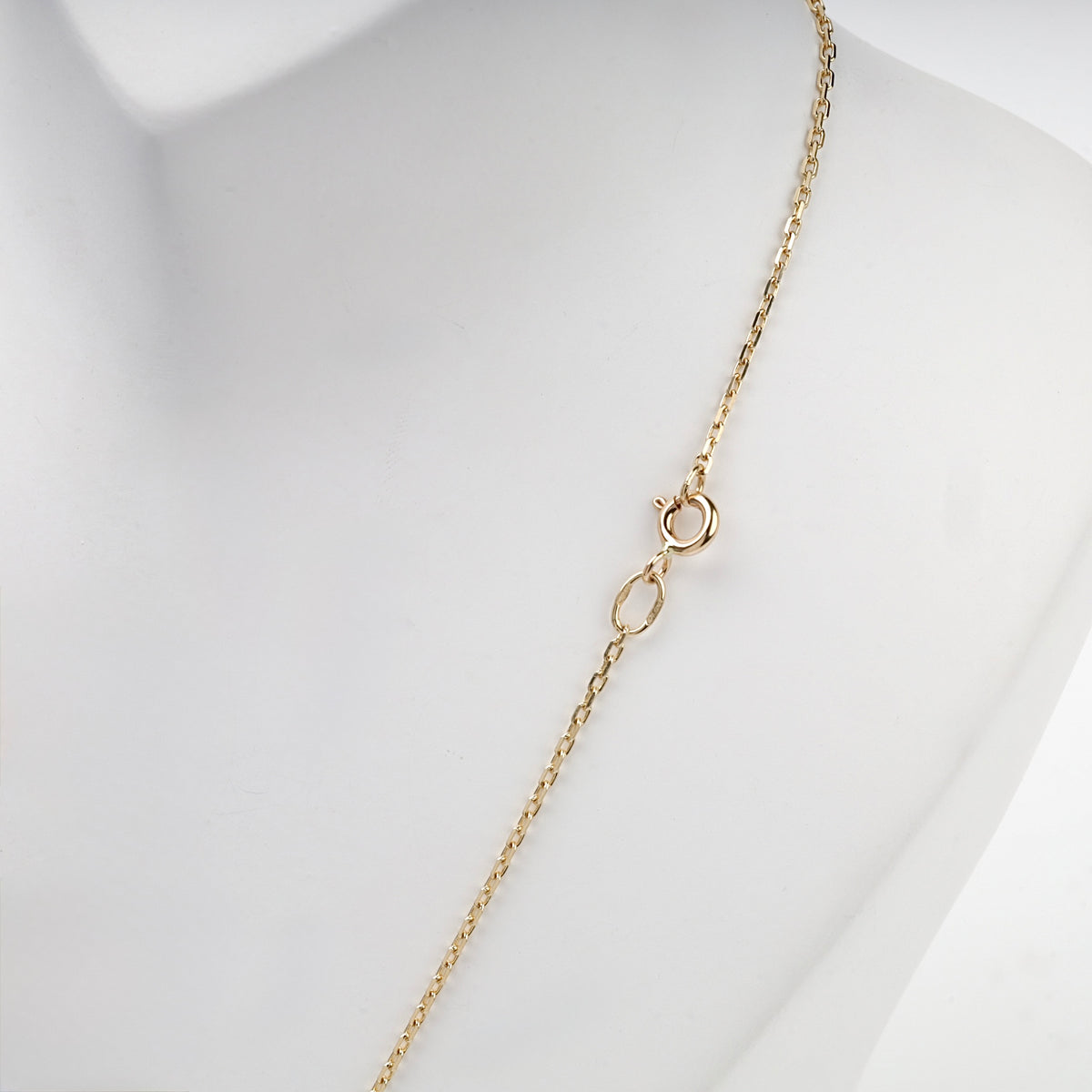 Yellow gold fine cable chain showing spring ring clasp