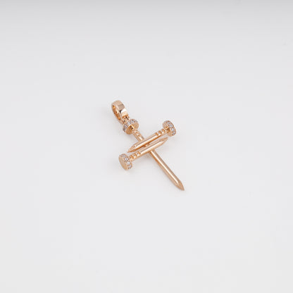 Rose gold nail cross pendant close-up showing zirconia detail