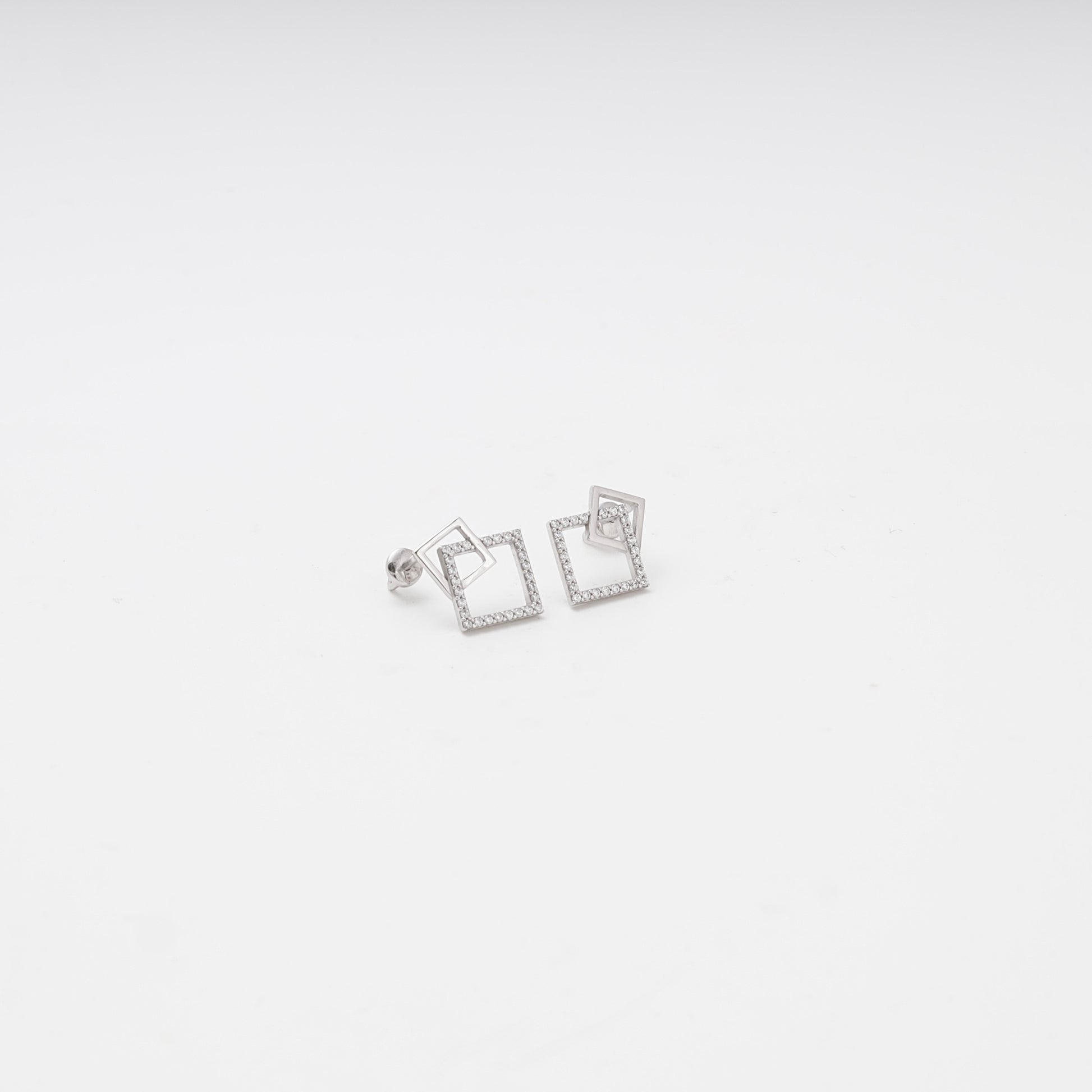 White gold geometric double square earrings with cubic zirconia, front view — Kabluchka