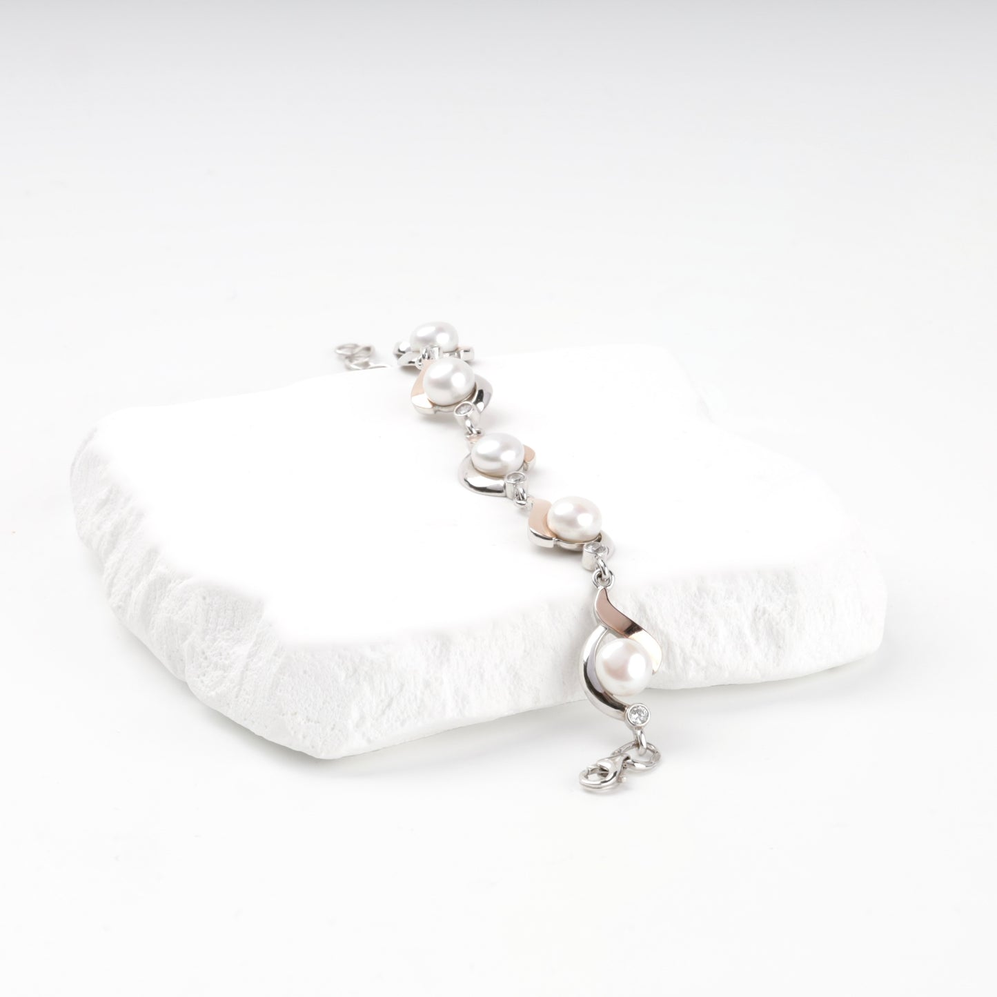 Two-tone pearl and cubic zirconia bracelet — angled view — Kabluchka