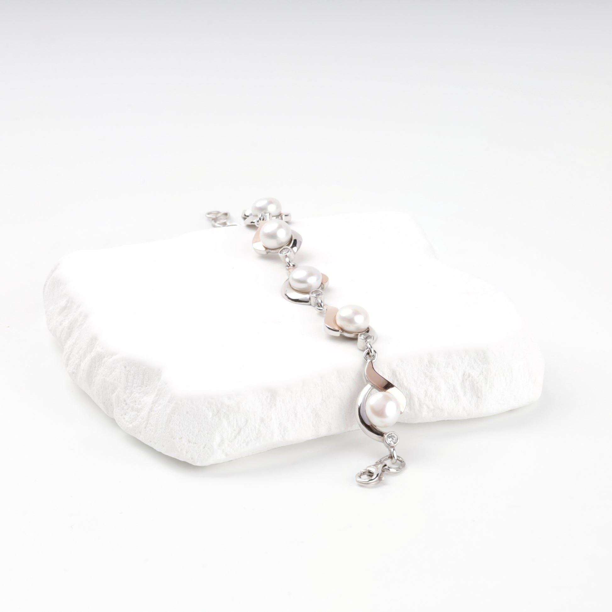 Two-tone pearl and cubic zirconia bracelet — angled view — Kabluchka