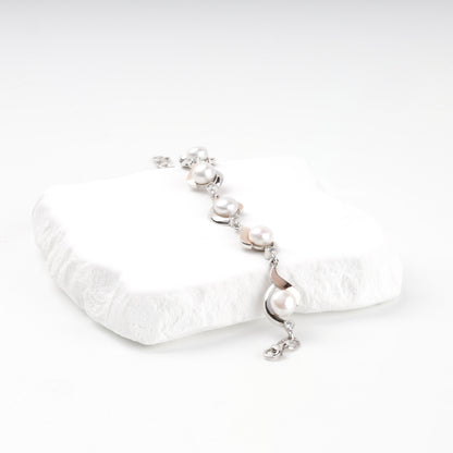 Two-tone pearl and cubic zirconia bracelet — angled view — Kabluchka