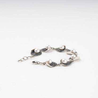 Close-up of pearl and cubic zirconia bracelet details
