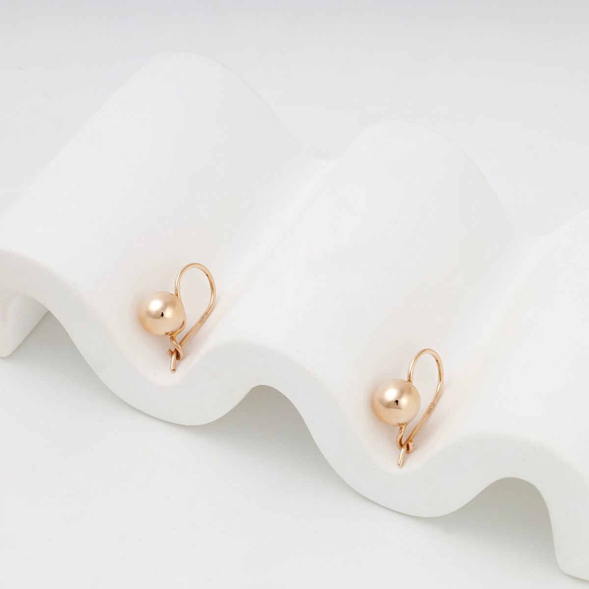 Rose Gold polished ball kids earrings with hook fastenings