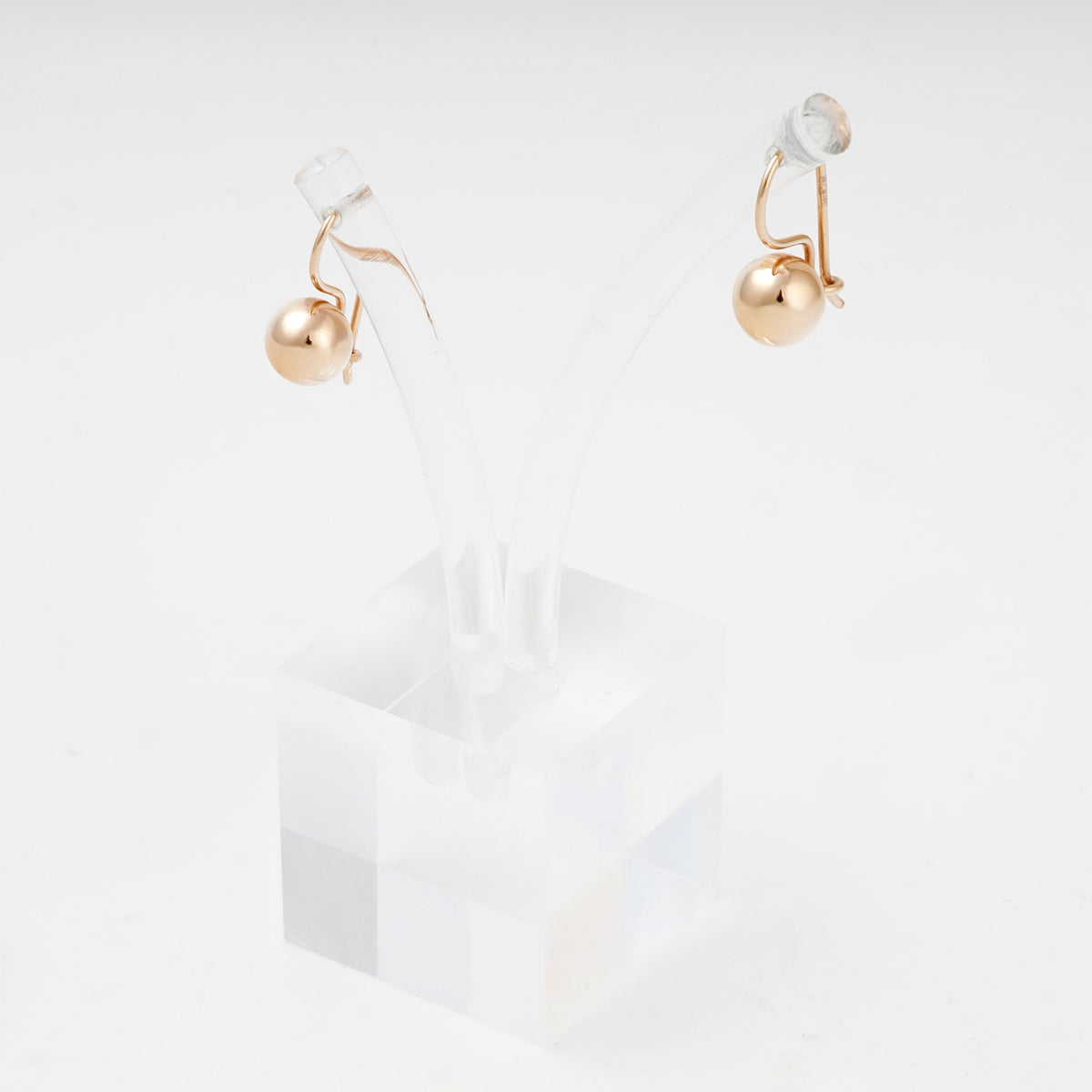 Rose Gold 14K polished ball earrings on display stand
