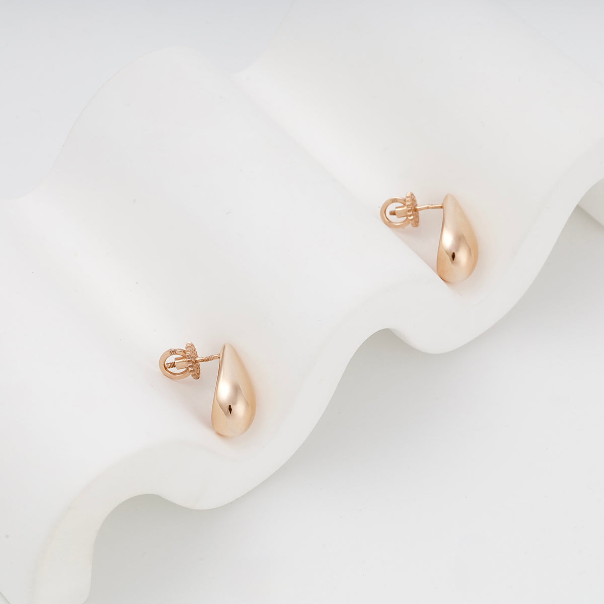 Rose Gold teardrop stud earrings with screw-back fasteners