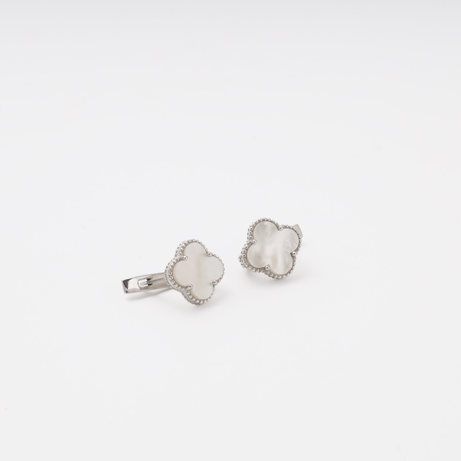 Silver mother-of-pearl earrings overhead view — Kabluchka