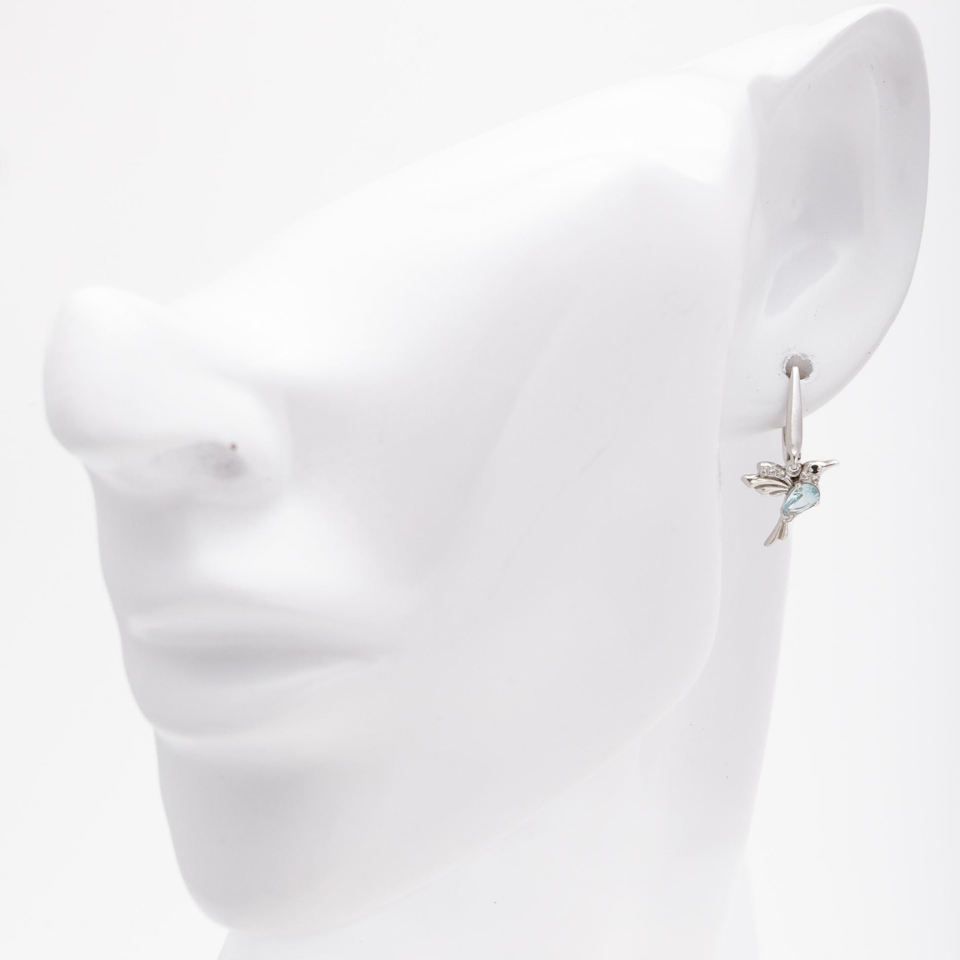 Silver 925 hummingbird earrings shown on ear model — Kabluchka
