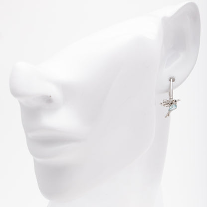 Silver 925 hummingbird earrings shown on ear model — Kabluchka