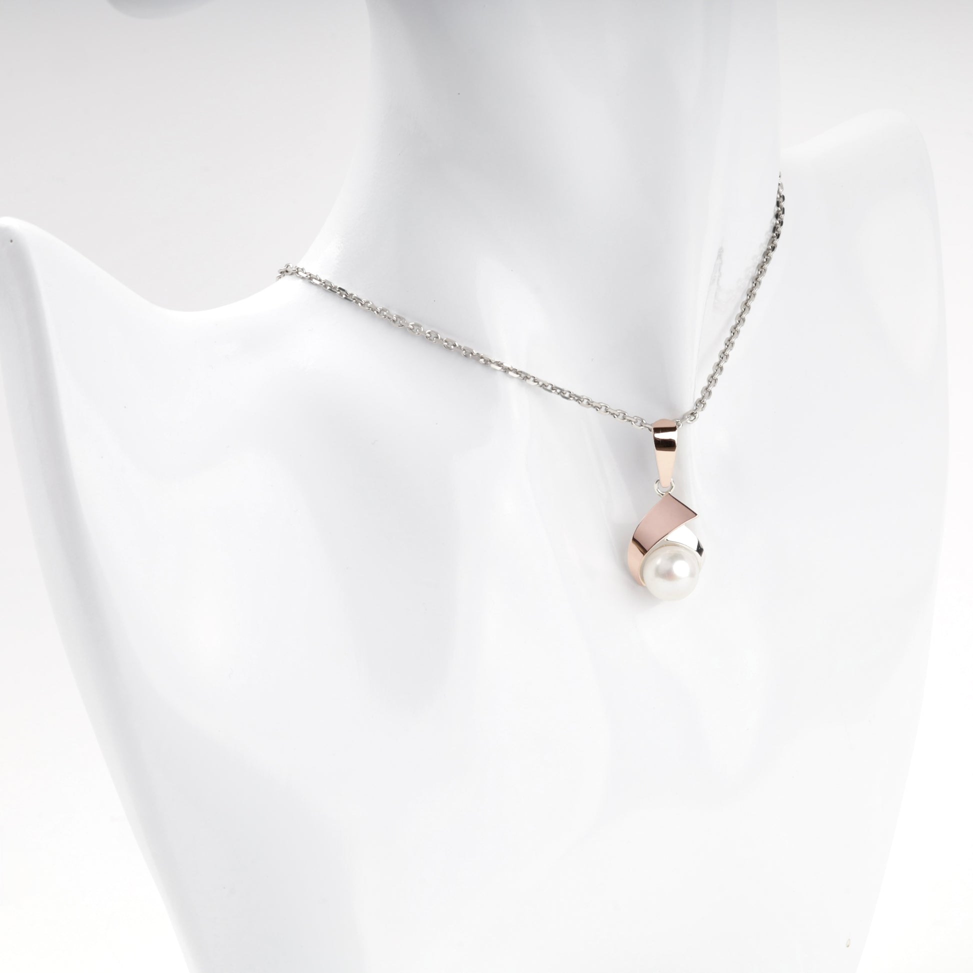 Cultured pearl pendant with warm rose-tone detail — worn view — Kabluchka